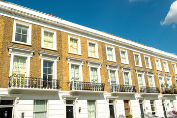 Street of white stucco residential terraced houses in Chelsea, south west London 