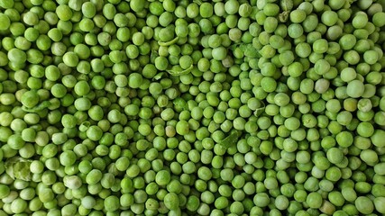 Fototapeta na wymiar frozen green peas, full screen image, top view