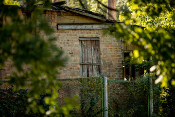 Fototapeta na wymiar part of an old brick house. old collapsed house
