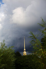 Obraz premium Amazing gold fragment of Peter and Paul Church against stormy cloudy dramatic sky in St Petersburg, Russia. 