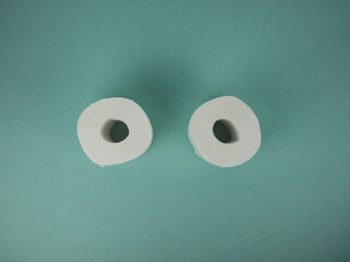 rolls of toilet paper on the table.