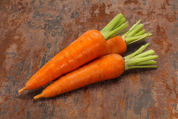 Three Young fresh ripe carrot