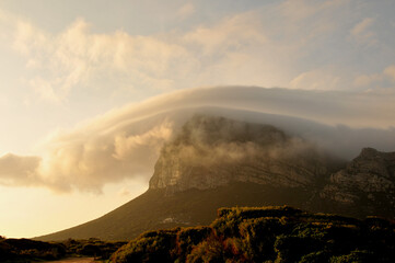 A late afternoon cloud cover hanging over a rock pinnacle in the Western Cape