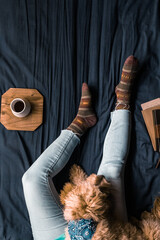 Woman lounging with dog