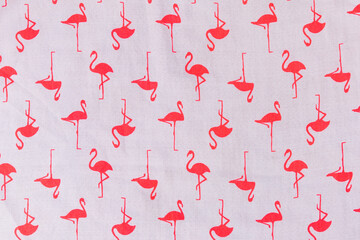 Beautiful seamless vector tropical pattern with pink flamingos on white fabric background. Abstract summer texture