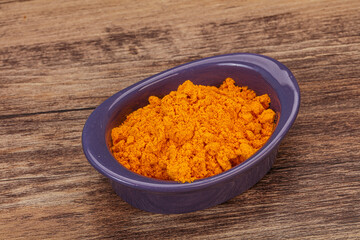 Tumeric powder in the bowl