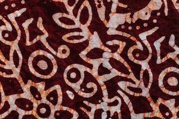 Seamless pattern of flowers on maroon color fabric background