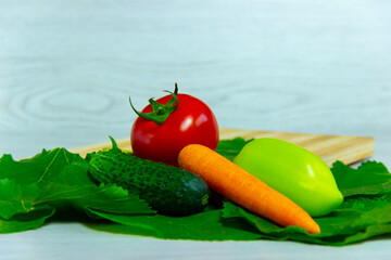 carrots, pepper, cucumber and tomato close up .