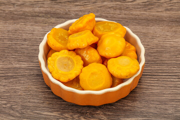 Marinated yellow patisson in the bowl
