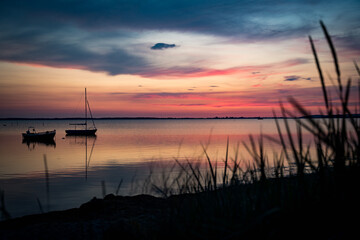 sunset on the river with sailing boats