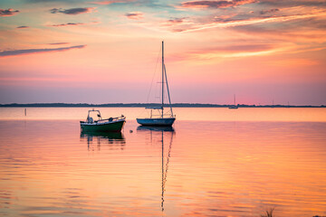 Fototapeta na wymiar sunset on the beach with boats