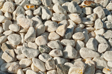 Drainage systems from small pebbles. Garden drainage for plants and trees. White stones for roads and flower beds.