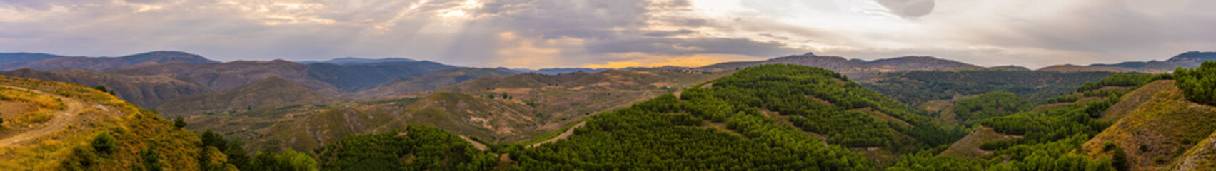 mountains and forests from the top at sunset