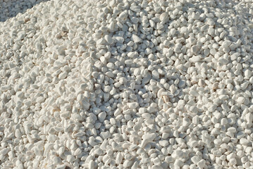 Drainage systems from small pebbles. Garden drainage for plants and trees. White stones for roads and flower beds.