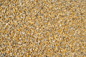 Drainage systems from small pebbles. Garden drainage for plants and trees. Yellow stones for roads and flower beds.
