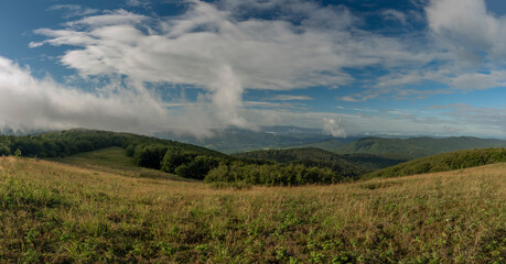 Panorama view from Duze Jaslo hill in summer cloudy morning