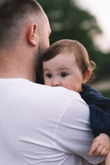 Fototapeta premium Father holding his little girl