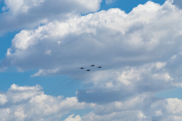 Fototapeta na wymiar Daylight. combat vehicle aircraft in the amount of four pieces. blue sky.
