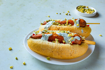 Hot dog with carrots on white plate. vegetarian fast food