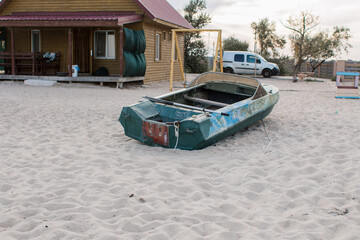 old boat on the beach with oars