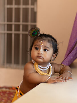 Cute baby dressed up like lord krishna/gopal in the occasion of janmashtami stock image.