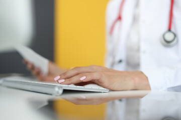 Hands of medical worker are typing text on keyboard. Medical diagnosis concept