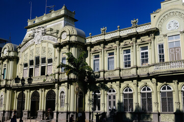 Main post office building Correos Central in San Jose with morning sun and blue sky