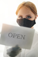 Girl hold notice sign