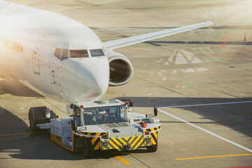 Towing the aircraft from the boarding bridge to the apron before departure.
