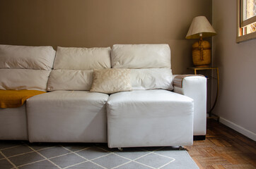 living room with white sofa and neutral tones, no person