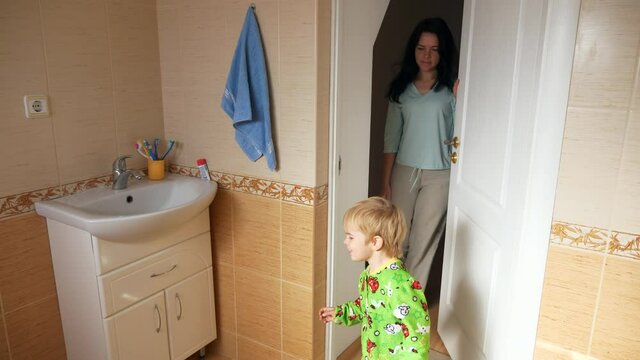 Happy Mother and Son going to Bathroom in Morning to Brush Teeth Wash Face. 2x Slow motion - 60FPS