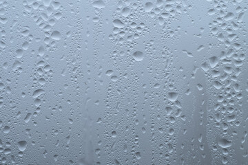 Texture of a drop of rain on the glass. Transparent background.