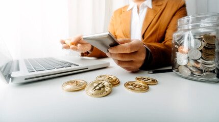 Businesswomen hands working with finances about cost and calculator and laptop with tablet, smartphone at office in morning light