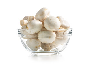 Fresh white champignon mushrooms in bowl.