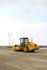 Fototapeta na wymiar roller in highway construction site