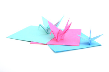 Naklejka premium Origami cranes with paper sheets
