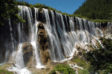 Juizhaigou (Nine Villages Valley) in Sichuan, China. View of Nuorilang Waterfall. Juizhaigou is a popular tourist destination in China famous for its waterfalls, lakes and scenic beauty.