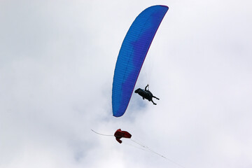 Paraglider being towed on a winch launch	
