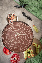 spiders web chocolate tart with green custard