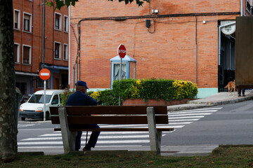 Fototapeta na wymiar Person sitting on a bench