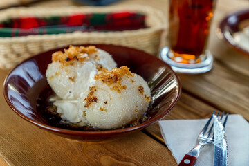 Traditional Lithuanian dish – dumpings or zeppelins (cepelinai) - made of potatoes with meat inside.