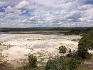 white geyser spewing water and steam 