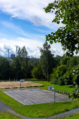 Basketball and volleyball courts in city park without people at isolation time