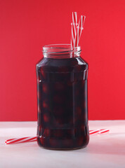 Cherry compote in a glass jar