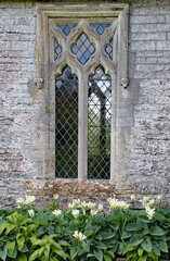 Fototapeta na wymiar An intricate window in an old English country house