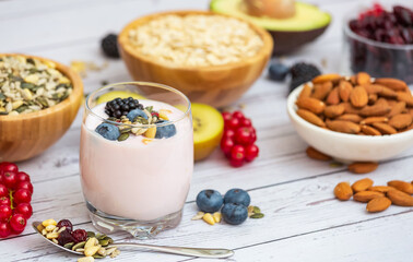 Group Fruits Breakfast with bread Whole grains and nuts, yogurt mix with Cherry , banana, avocado in the wooden table. Breakfast for Health and Diet concept