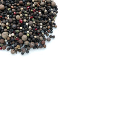 A handful of different types of pepper close-up isolated on a white background.  Assorted Pepper Peas. Background for inserting text or images, free space.