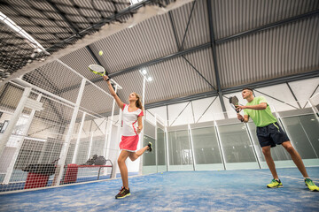 Fototapeta na wymiar paddle tennis indoors training, wide angle shot