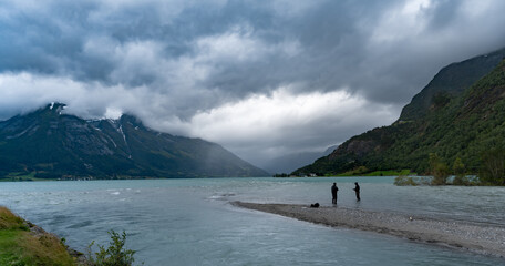 Fishermen in the village of Hjelle catching salmon as they enter the lake Strynsvatnet from the fjord, near the Jostedalbreen National Park, Norway.