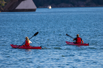 Two people kayaking on the ocean